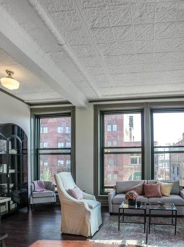 Apartment living space with view of Center Ave - The Legacy